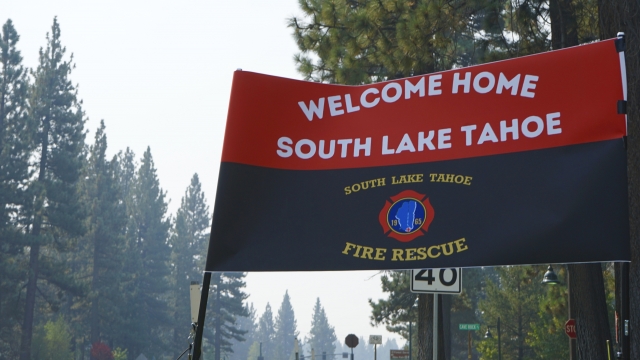 A sign outside a South Lake Tahoe Fire Station welcomes people back after the lifting of the evacuation order Monday.