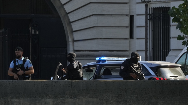 Security forces guard an entrance of the Palace of Justice Wednesday, Sept. 8, 2021 in Paris.