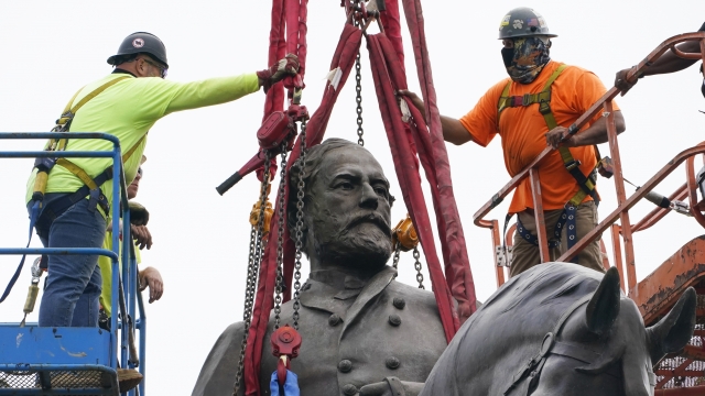 Crews work to remove one of the country's largest remaining monuments to the Confederacy.