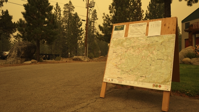 A U.S. Forest Service bulletin board displays information about closures and evacuations in California.