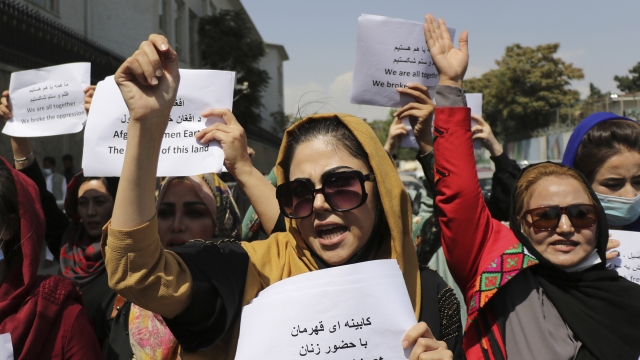 Women gather to demand their rights under the Taliban rule during a protest in Kabul, Afghanistan