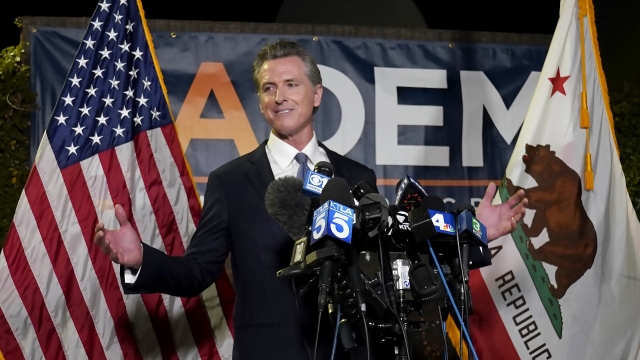 California Gov. Gavin Newsom addresses reporters after beating back the recall attempt.