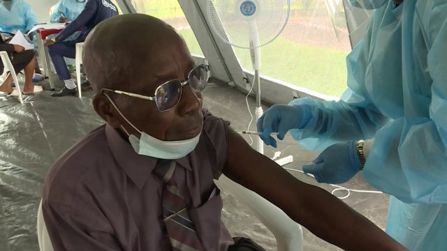 A man gets a COVID-19 vaccine in Kinshasa, Congo.