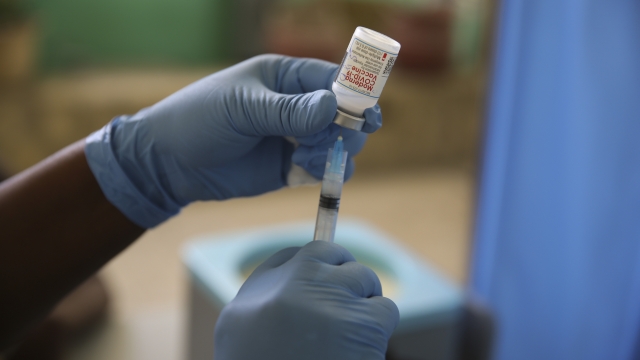 A medical worker prepares a shot of the Moderna vaccine during a vaccination campaign.