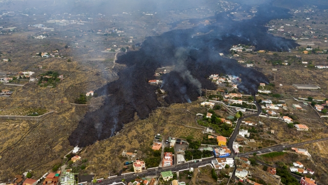 Lava from a volcano eruption flows destroying houses on the island of La Palma in the Canaries, Spain.