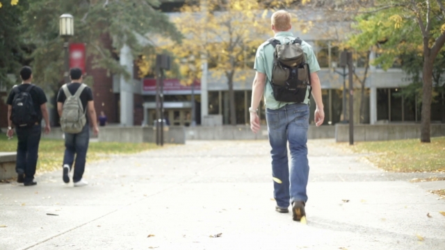 Student walks on campus.
