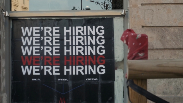 "We're hiring" sign.