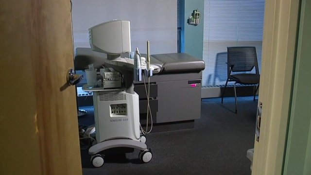 Equipment sits in an exam room.