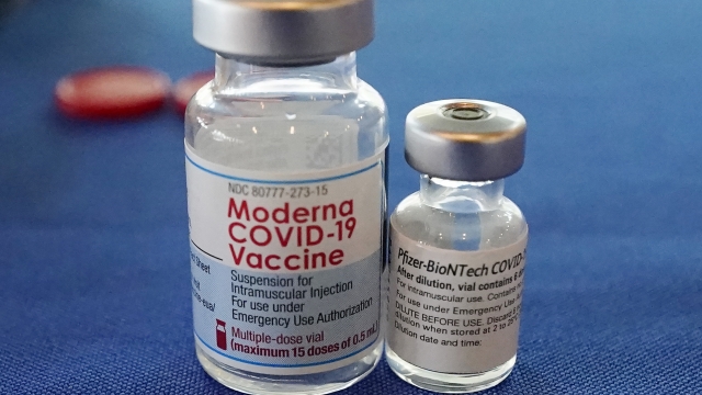 Vials of the Pfizer and Moderna COVID-19 vaccines.