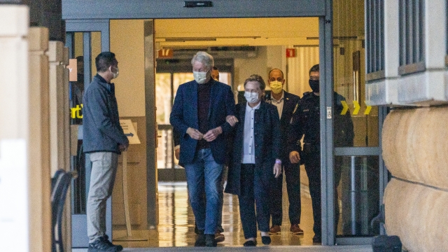 Former President Bill Clinton and former U.S. Secretary of State Hillary Clinton leave a hospital