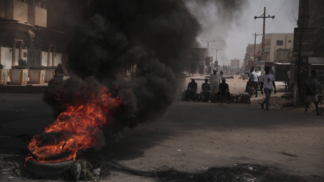 People burn tires during a protest a day after the military seized power Khartoum, Sudan.