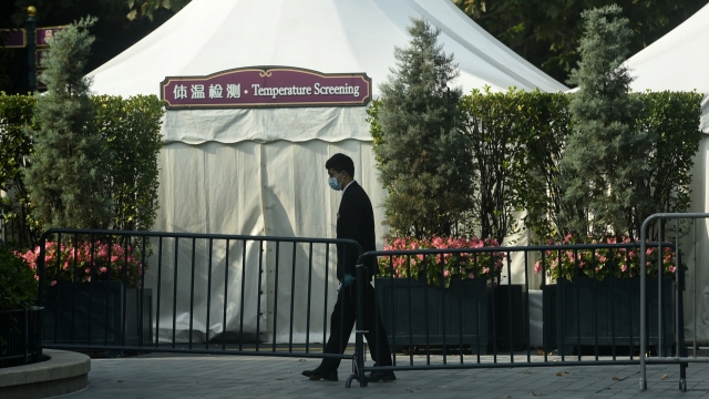 A closed temperature screening booth set up at the entrance gate to the Shanghai Disney Resort