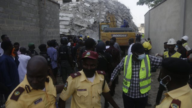 Rescue workers at the site of the 21-story high-rise apartment building collapse in Lagos, Nigeria.