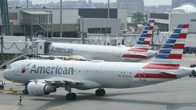 American Airlines passenger jets prepare for departure