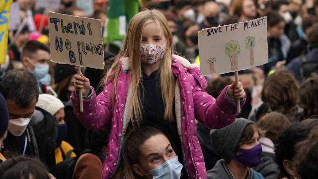 Climate activists march through the streets of Glasgow, Scotland