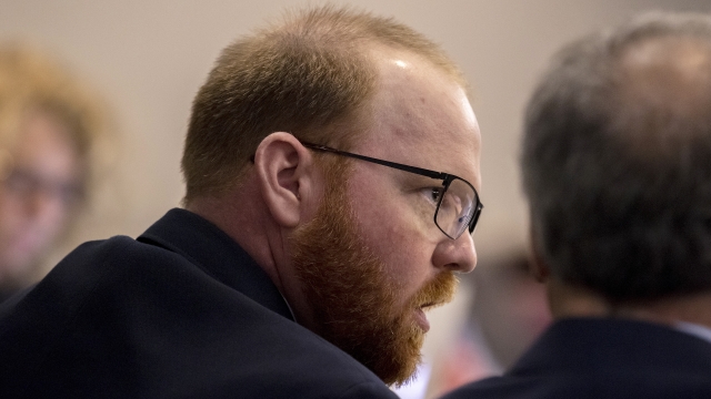 Travis McMichael speaks to his attorney Robert Rubin during his trial
