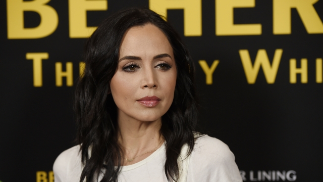Eliza Dushku poses at the premiere of the film "Be Here Now (The Andy Whitfield Story)."