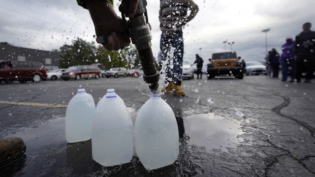 A man fills up jugs with non-potable water in Benton Harbor.