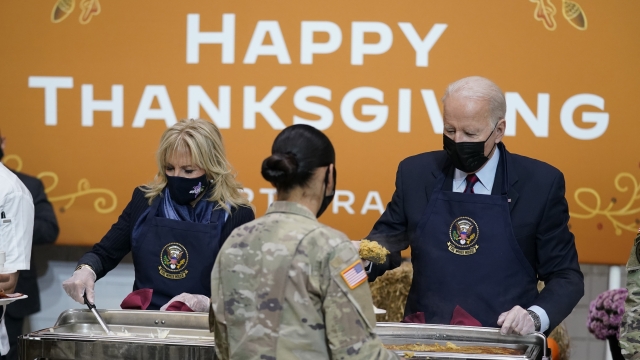 President Joe Biden and first lady Jill Biden serve dinner during a visit to Fort Bragg