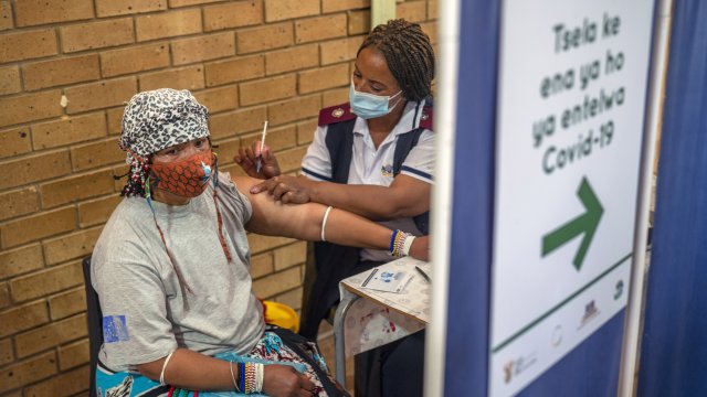 A South African resident receives her vaccine.