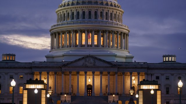 The Capitol is shown at night.