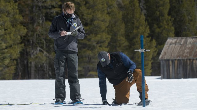 California Department of Water Resources check the depth of a snow pack.