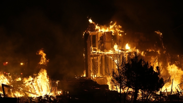 Homes burn as a wildfire rips through a development in Colorado