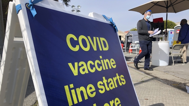 A sign is displayed at a COVID-19 vaccine site