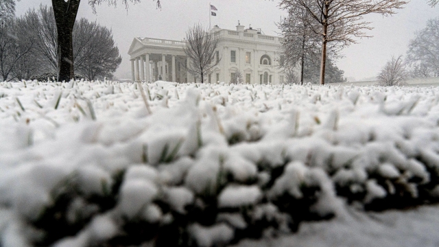Snow falls at the White House in Washington
