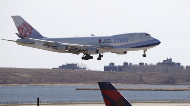 An airplane lands at John F. Kennedy International Airport