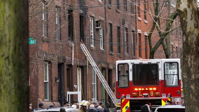 Philadelphia firefighters at the scene of deadly fire
