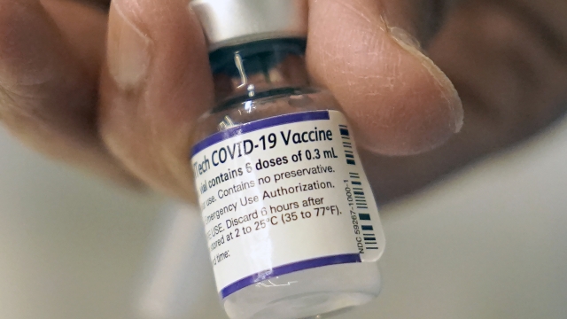 A dose of Pfizer COVID-19 vaccine being loaded into a syringe