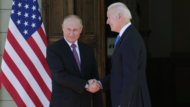 Russian President Vladimir Putin, left, and U.S President Joe Biden shake hands.