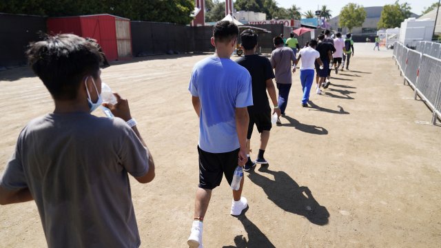 Children walk at a shelter for migrant kids.