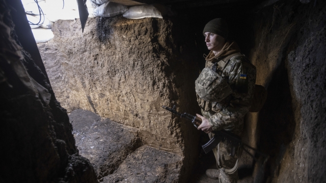 An Ukrainian soldier stands in the trench on the line of separation from pro-Russian rebels