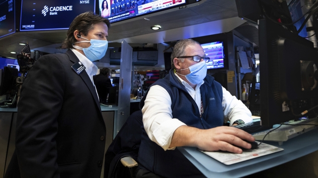 A man uses a computer at the New York Stock Exchange