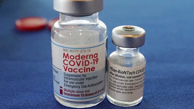 Vials of the Pfizer and Moderna COVID-19 vaccines