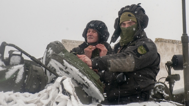Ukrainian soldiers examine their tank at a military unit close to Kharkiv, Ukraine