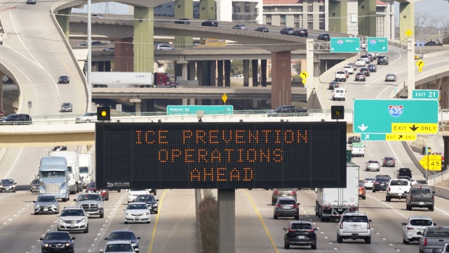 A street sign warns drivers of ice prevention operations on highways