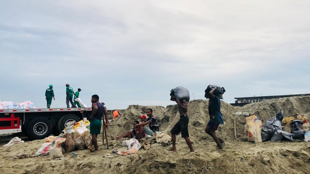 People making their way home during bad weather in Madagascar.