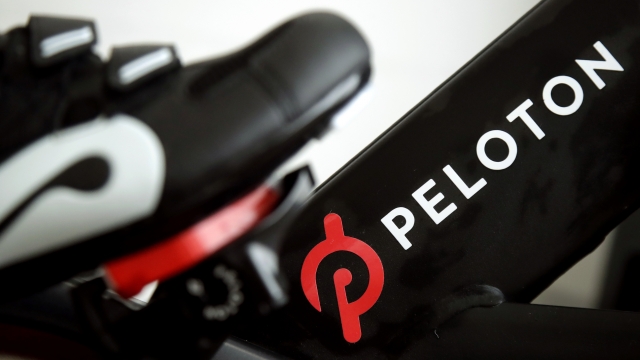 The logo on a Peloton bike