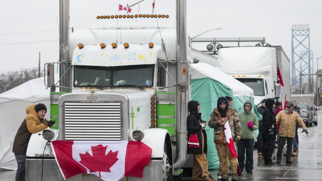 Truckers and supporters block the access leading from the Ambassador Bridge