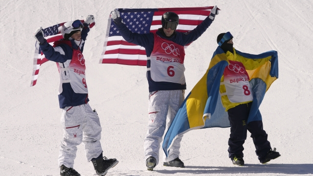 Silver medal winner United States' Nick Goepper, gold medal winner United States' Alexander Hall hold American flags