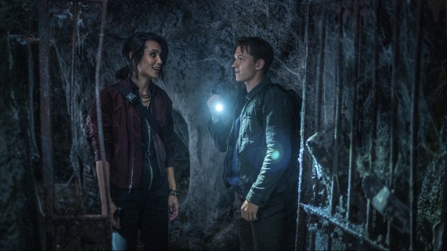 Sophia Taylor Ali and Tom Holland appear in a scene from "Uncharted."