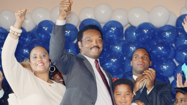 Jesse Jackson is joined by his daughter, Santita, left, and son Jonathan, far right
