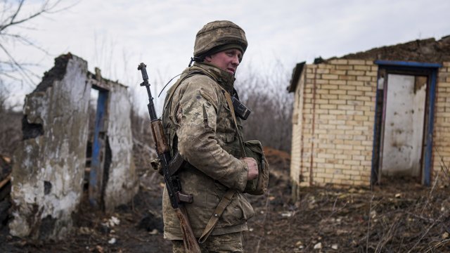 A Ukrainian serviceman stands at his position
