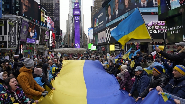 Pro-Ukraine demonstrators unfurl a large Ukraine flag in New York's Times Square