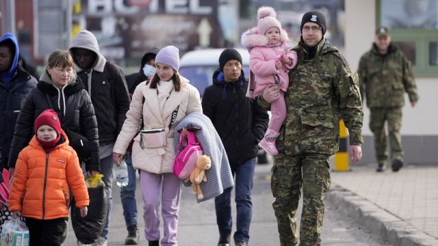 Refugees from Ukraine cross into Poland at the Medyka crossing