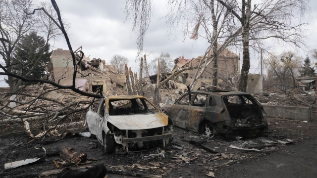 Gutted cars following a night air raid in the village of Bushiv, Ukraine