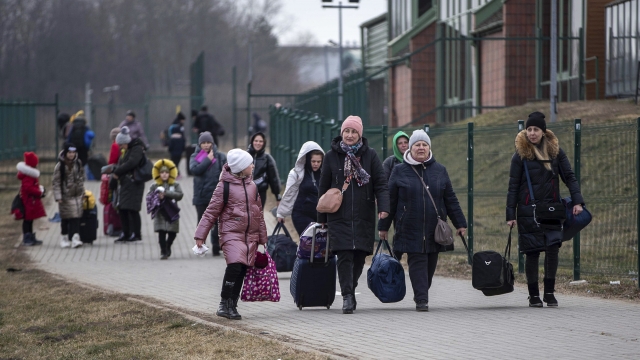 Women and children, fleeing from Ukraine, arriving at the border crossing in Medyka, Poland